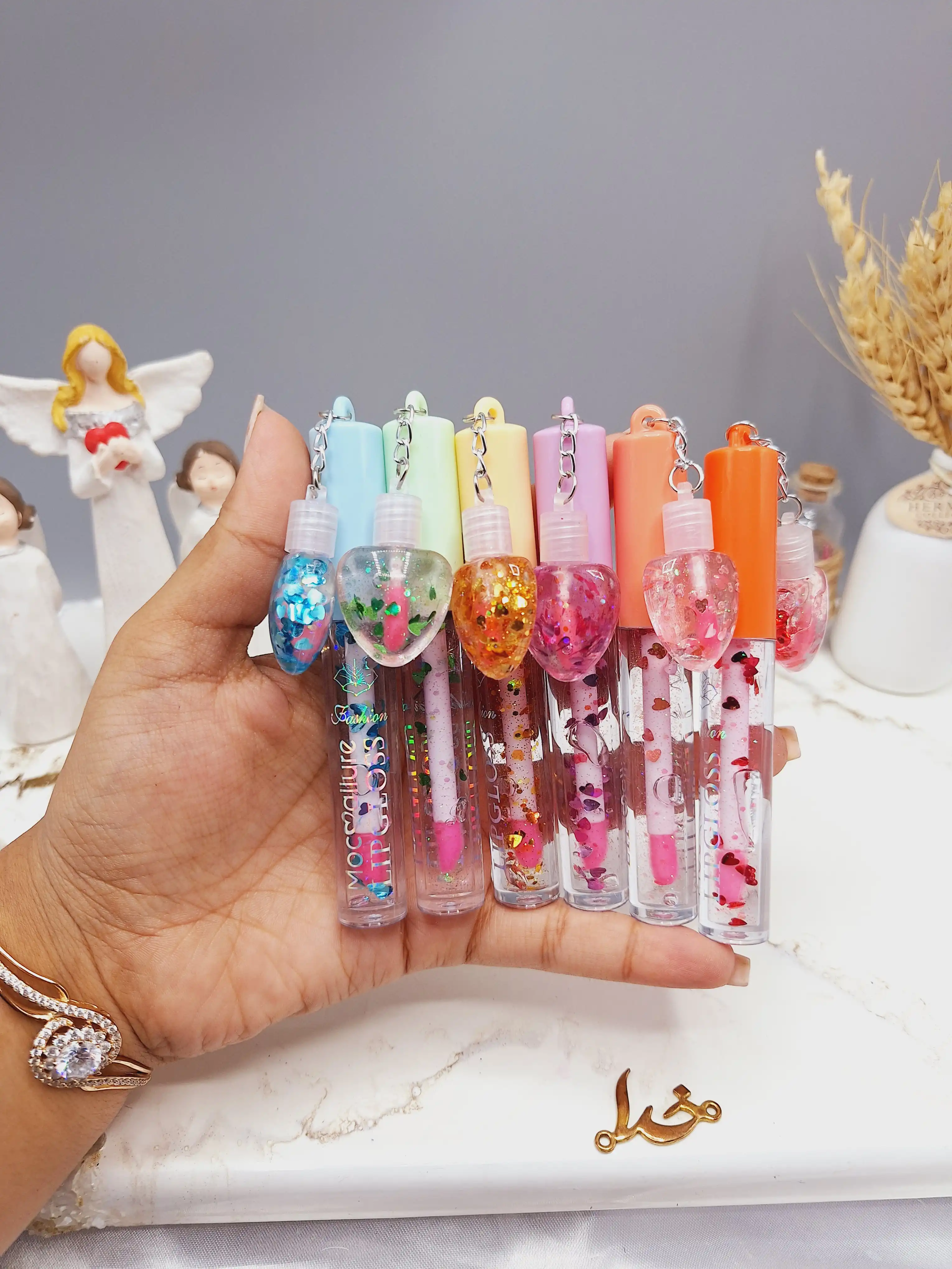 ست 2 تایی لیپ گلاس گلیتری طرح قلب برند موکالره Mocallure کد 125